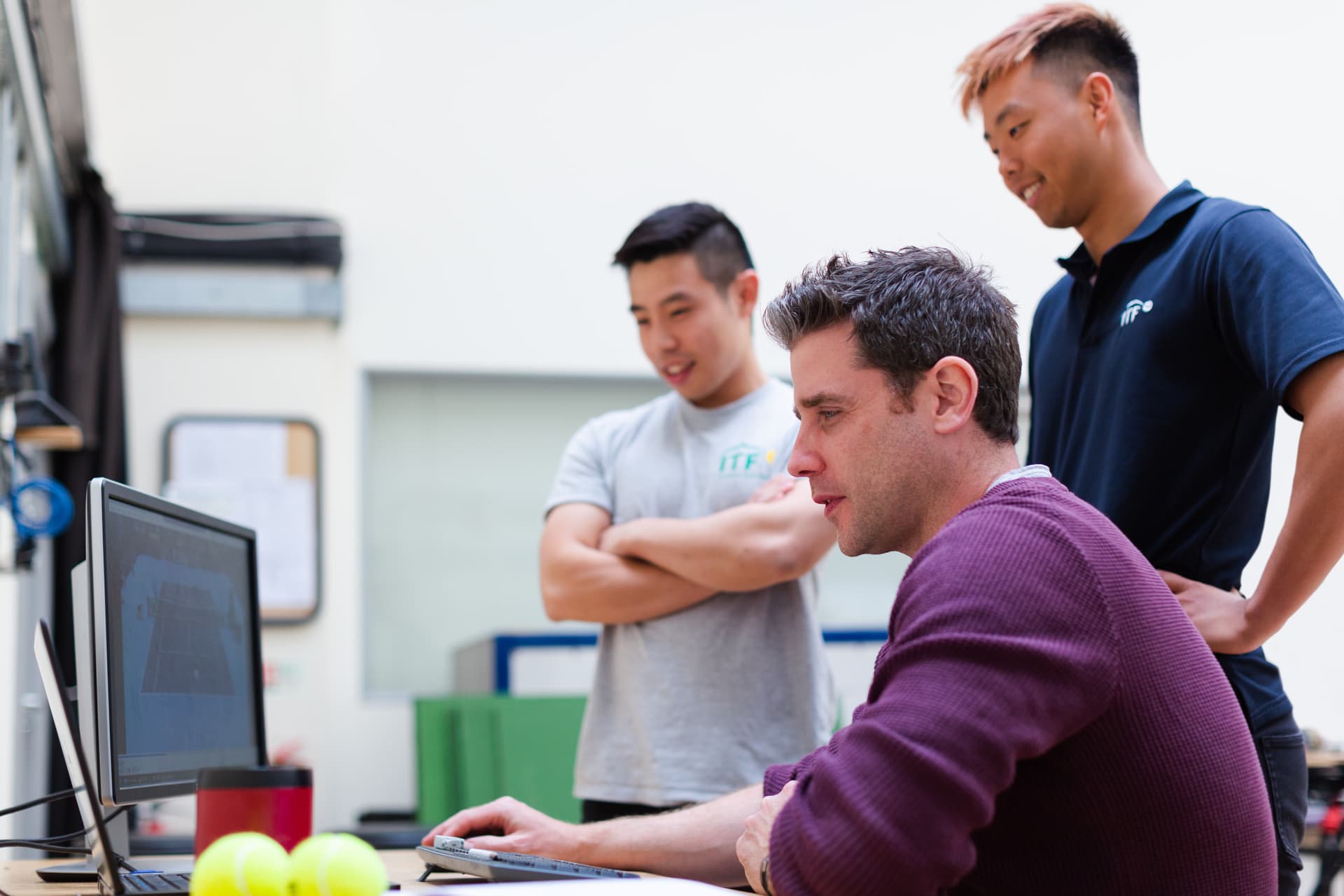 Team members solving problem on a computer